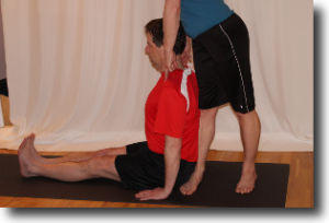 Dandasana - staff pose from the side with leg assist